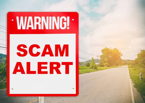 A warning sign warning about Scam in road ahead. — Stock Photo, Image