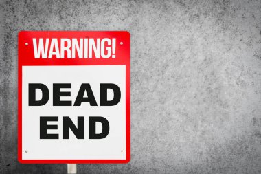 Çıkmaz sokak uyarı işareti gri çimento duvar ile.