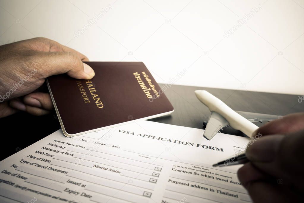 Tourist is filling a visa application form