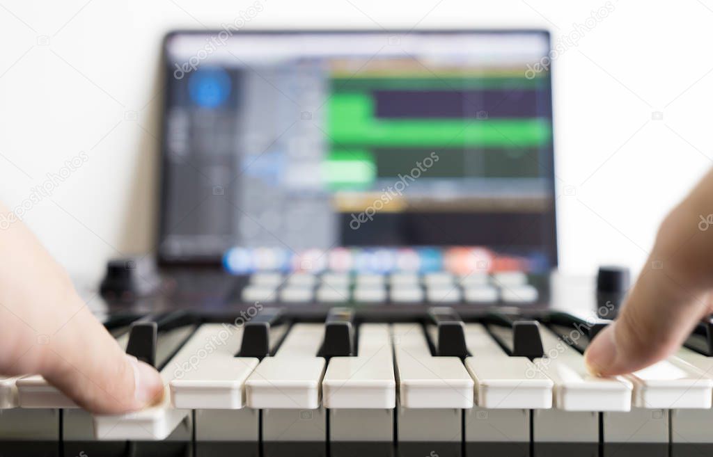 Music song arranger is working in his home studio