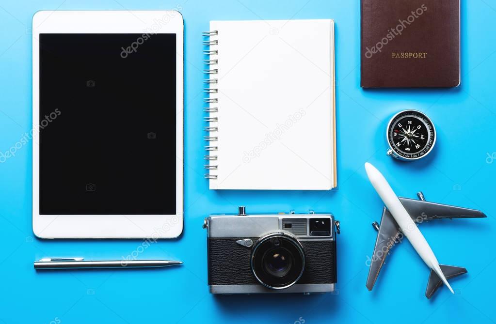travel blogger writing equipment on blue background