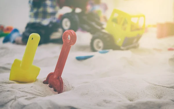 Toy Shovels in children sand box playground. — Stock Photo, Image