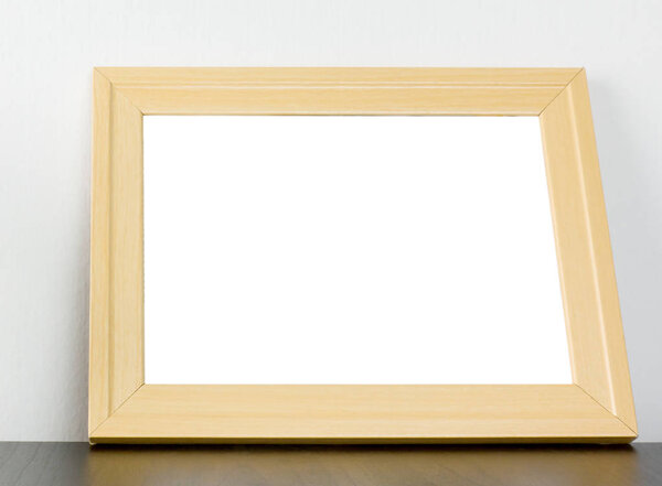 Blank Wooden frame on shelf with copy space