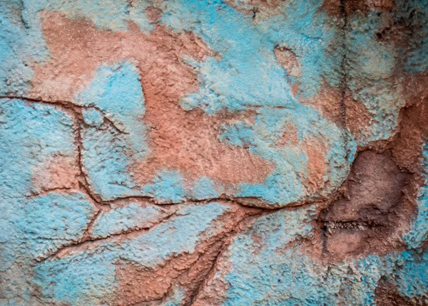 Textura da parede de rocha com dor azul e laranja — Fotografia de Stock