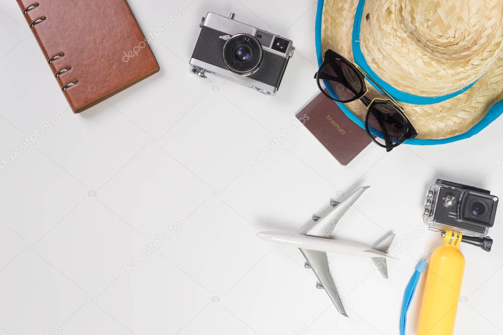 Summer travel accessories and gadgets on white copy space