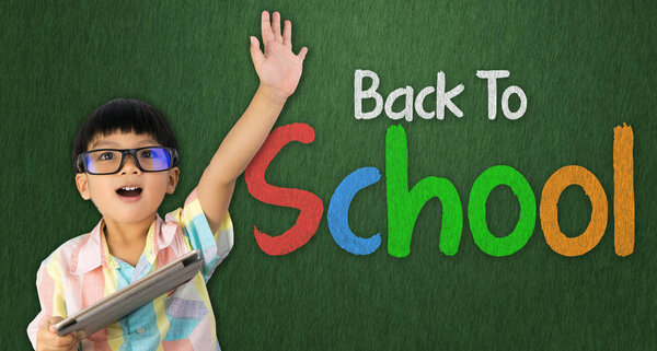 Asian boy raised hand ready to go back to school