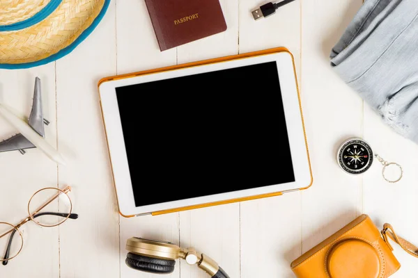 Blank tablet surrounded by summer travel equipment — Stock Photo, Image