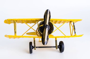 Beyaz arka plan üzerinde Vintage Sarı metal oyuncak uçak