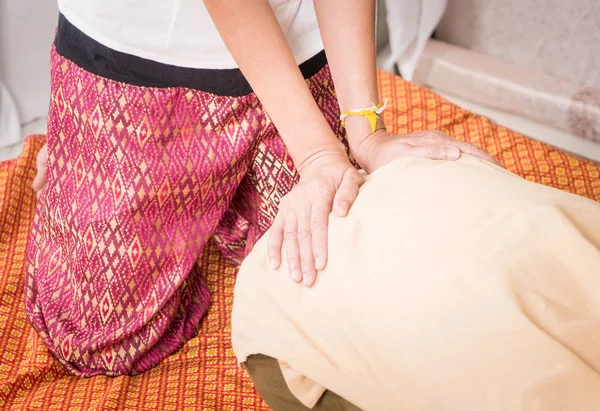 Massage therapist is massaging a women hip and back — Stock Photo, Image
