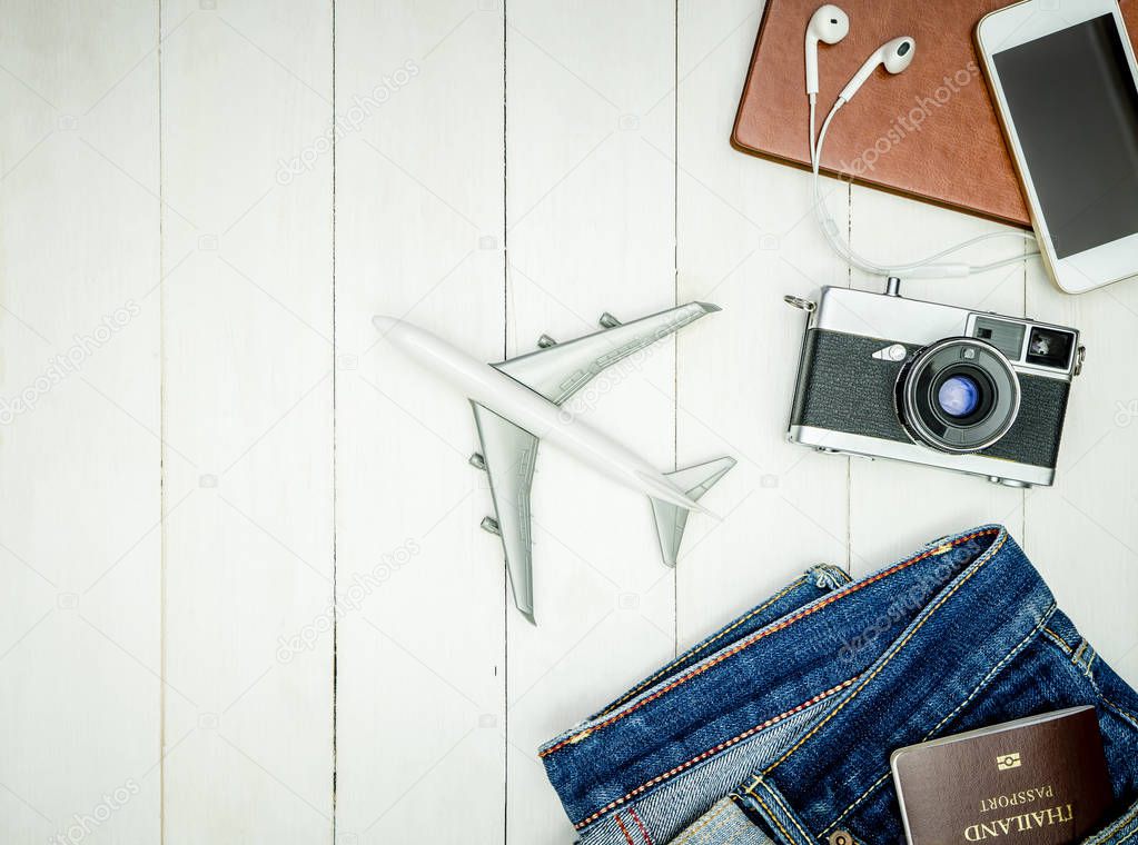 Hipster Blogger travel accessories prepared on white wooden flat lay, top view