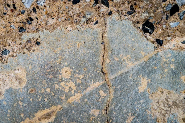 Pęknięty cementu ściany z opoka piasek teksturę — Zdjęcie stockowe