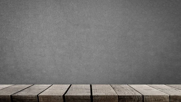 Blank wooden display shelf on gray cement wall — Stock Photo, Image