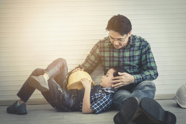 Builder Father is talking to his son for future career and teach