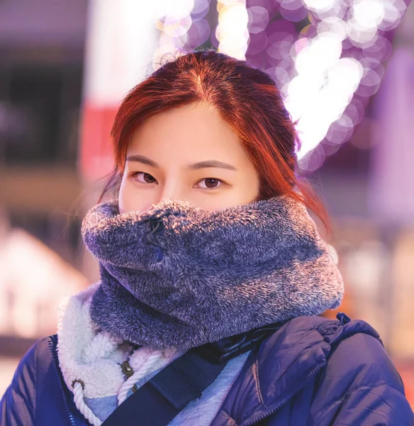 Asian woman in thick winter clothing in Japanese winter portrait