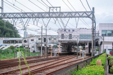 Passenger are commuting in Toba train station.