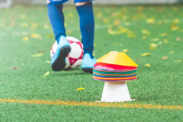 Soccer training cone and equipment on green sport field for foot — ストック写真