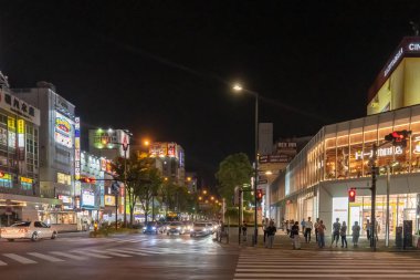 Commuters are travel in the busy street of Kawazaki.