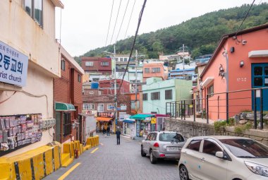 Busan; Korea - 27 Sep 2019 : Tourist are taking photo with the art work decoration in the street of Gamcheon Culture Village, Busan.