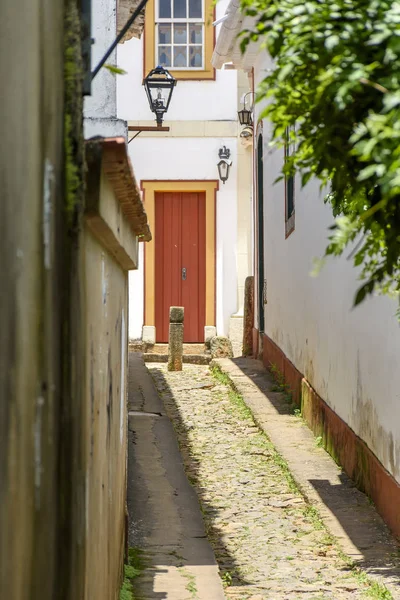 Alley with old houses in colonial architecture and cobbled street in the city of Tiradentes