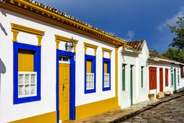 Streets of the old and historic city of Tiradentes with their houses in colonial architecture and stone paving whit afternoon lights