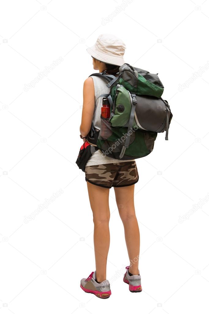 Woman hiker with backpack and sleeping bag walking, select focus