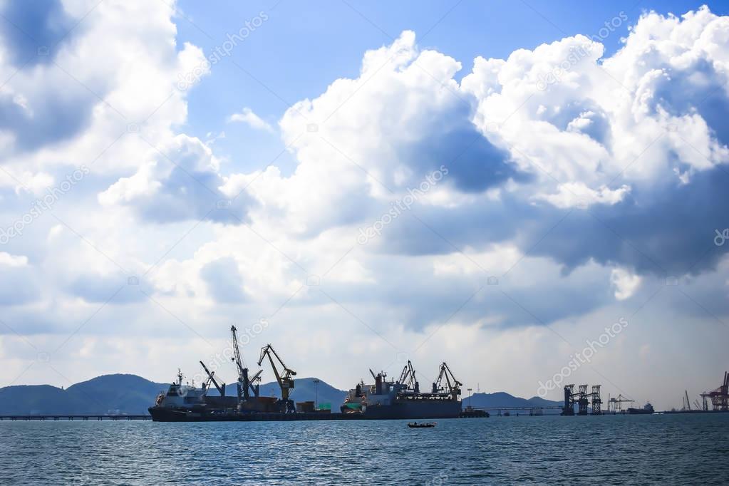 Cargo ship sailing in still water, Thailand