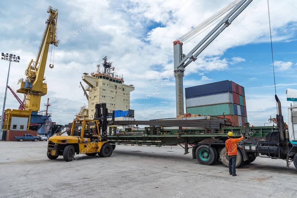 the operation of discharing loading carry on the port terminal by the ship vessel and the workers stevedore attenting through the time for transport and logistics system services