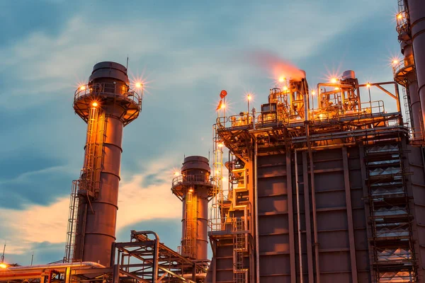 petrochemical plant in silhouette image at sun set