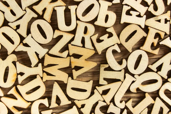 Letters van het alfabet gemaakt van hout voor achtergrond — Stockfoto