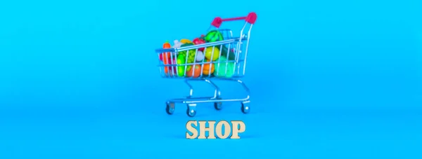 Shopping cart with fruits and vegetables — Stock Photo, Image