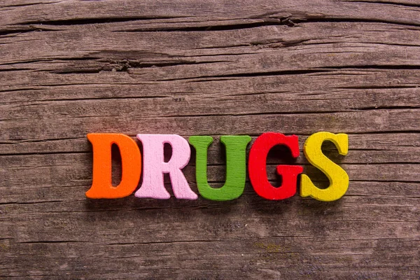 Drugs word made of wooden letters — Stock Photo, Image