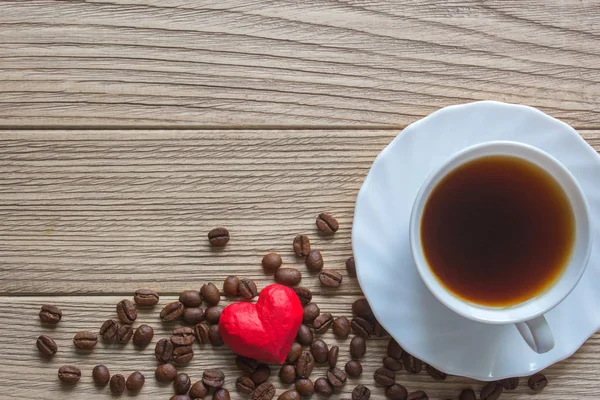Hjärtat kondom och en kopp kaffe — Stockfoto