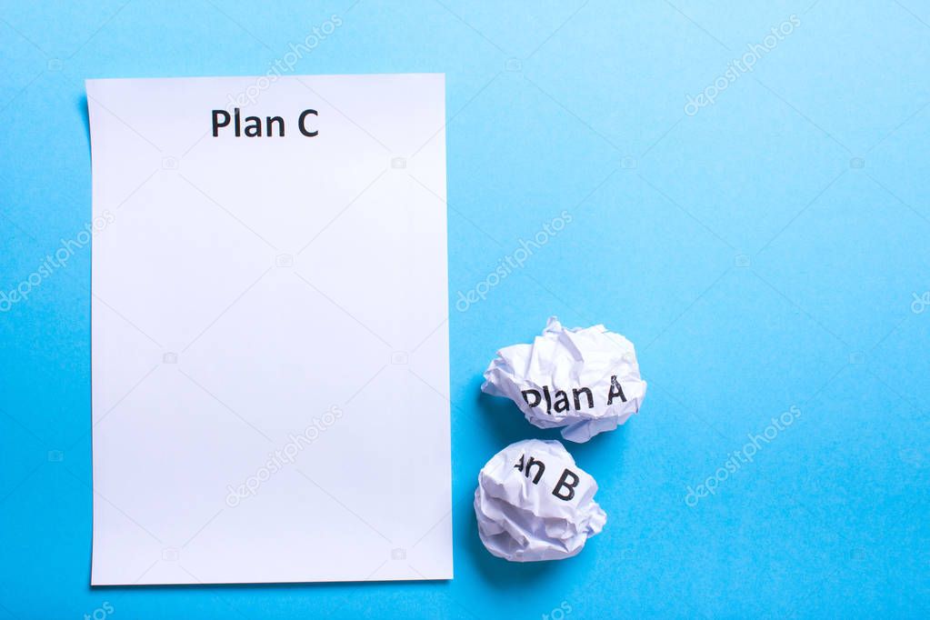 Crumpled paper Plan A B and clean sheet Plan C