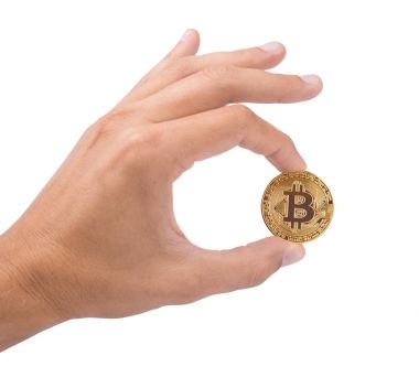 Elini bir altın para bitcoin para tutar. Tamam sembolüdür. ISO