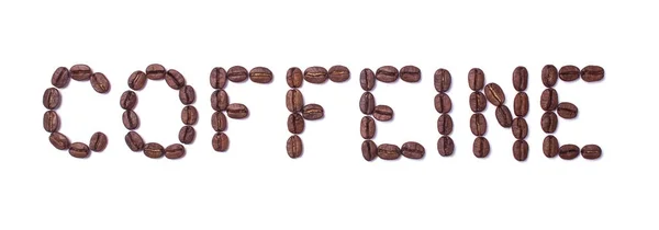 Word kofeiny z ziaren kawy na białym tle — Zdjęcie stockowe