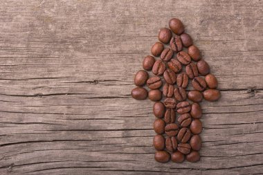 kahve çekirdekleri eski bir ahşap zemin üzerine ok yukarı. Kopya hamur metin