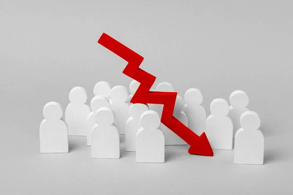 Bad team work, failure in business. The fall in profits and growth indicators. Group of workers and  pointing down arrow. Concept — Stock Photo, Image