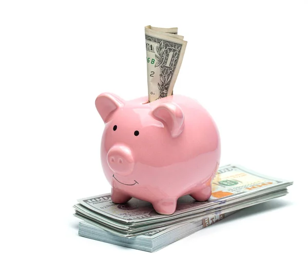 Pink piggy bank and dollar bill isolated on a white background — Photo