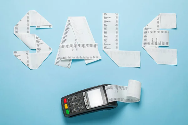 Sale of paper bill and pic terminal for payment on a blue background