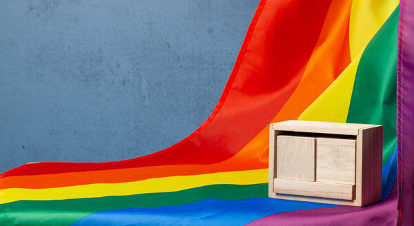 LGBT calendar. Mock-up blank template for date on LGBT pride flag background. Copy space for text.