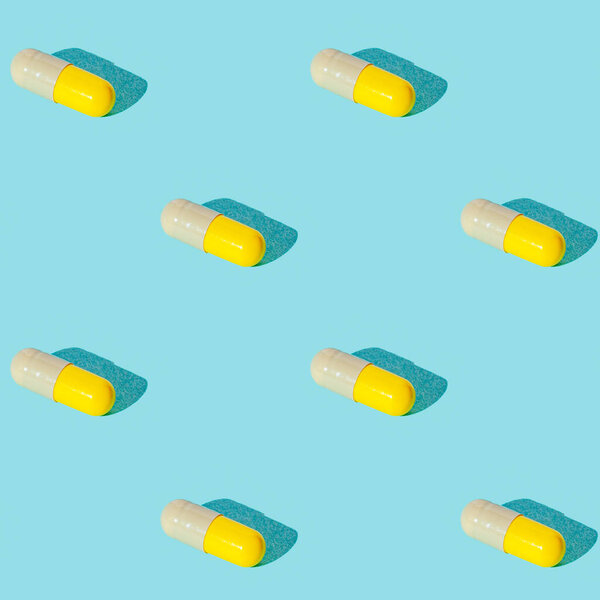 Seamless texture pattern. Pills in capsule on a green background. Set. Long harsh shadow from the summer sunshine