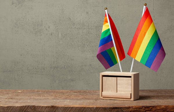 LGBT calendar. Mock-up blank template for date on LGBT pride flag background. Copy space for text.