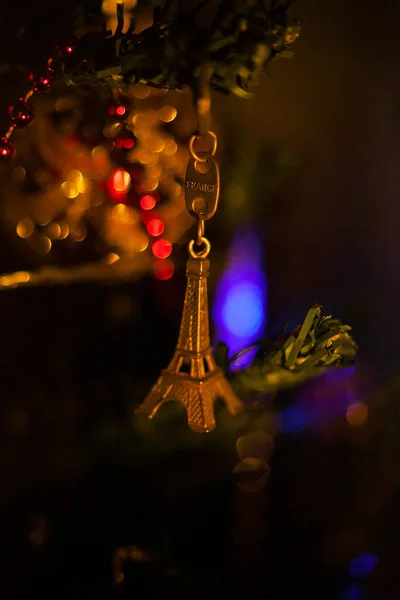 New Years wish. toy eiffel tower on christmas tree