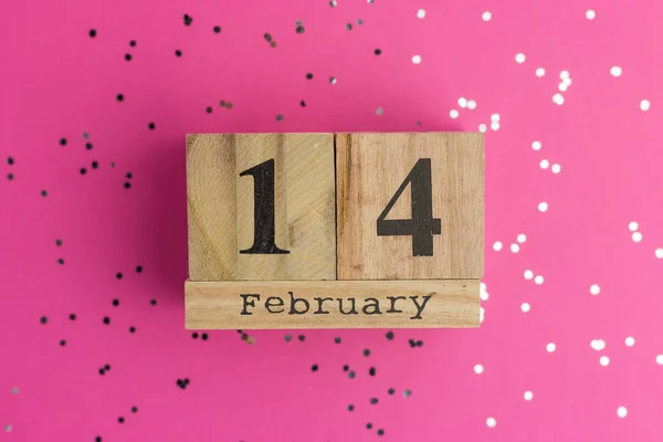 Valentine's Day On Calendar. February 14. Pink background with multicolored confetti. Flat lay style. Top view — Stock Photo, Image