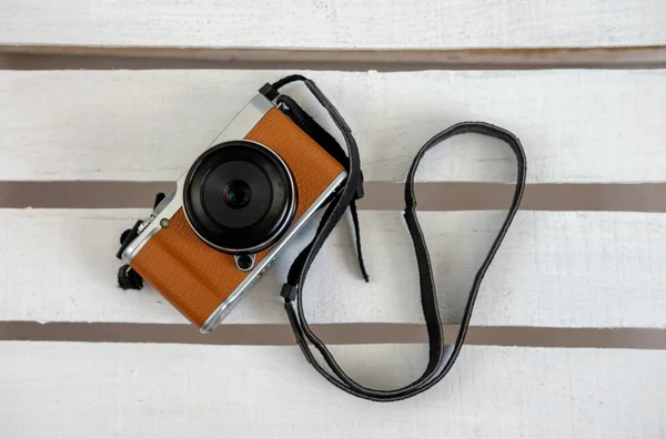 Mirrorless camera on white boards — Stock Photo, Image