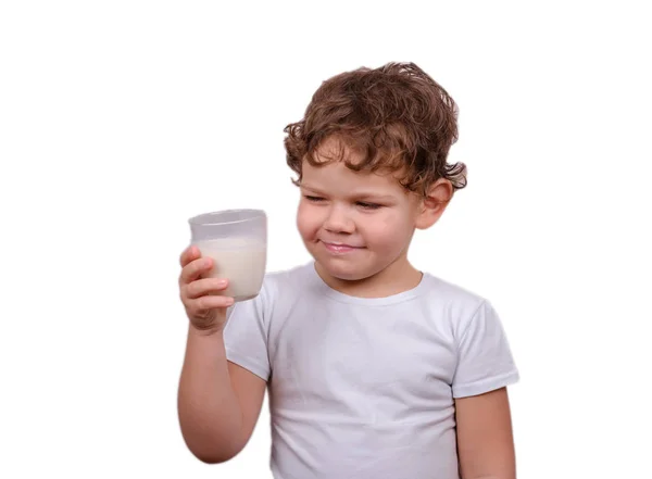 Cute European boy drinking milk on white background — Stock Photo, Image