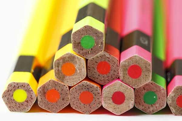 Crayons lay on the floor lined up several. — Stock Photo, Image