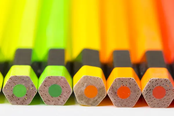 Crayons shades of orange and green. — Stock Photo, Image