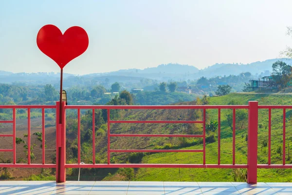 Red heart and pink fence — Stock Photo, Image