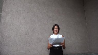 Young Beautiful Business Woman Female Girl Portrait Hold Throw Documents on Background Office Building Outdoor